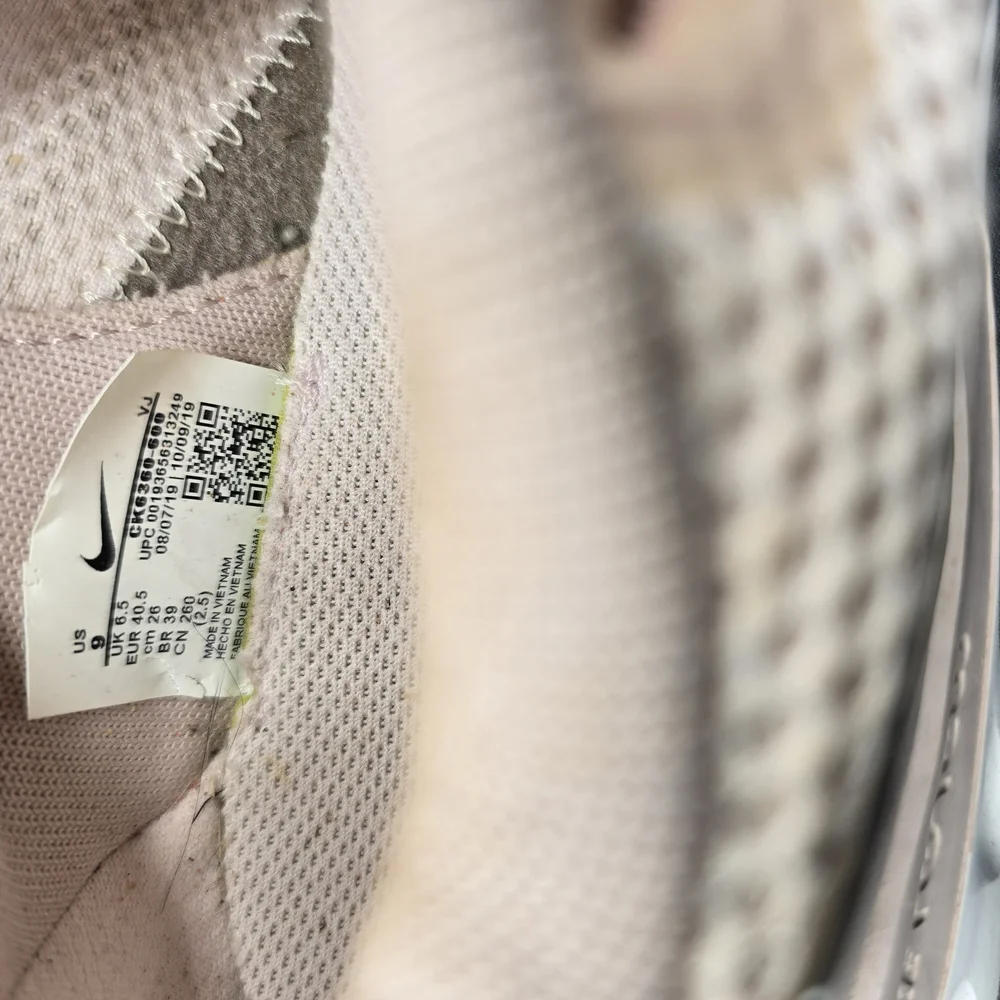 Nike Cream and White Athletic Shoes with Streamlined Design‎